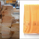 On left: a stack of lumber. On right: an unwrapped slice of American cheese